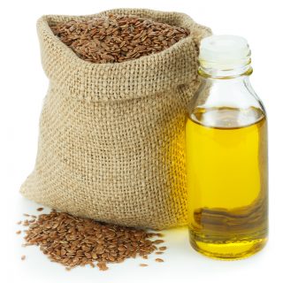 Linseed oil and flax seeds in small sack